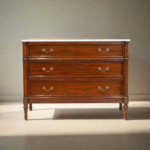 Wooden dresser with marble top on a white background